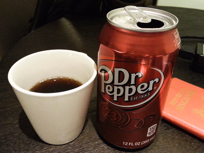A can of Dr Pepper and a cup of it